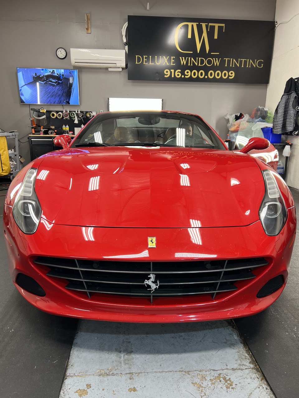 Red Ferrari in a professional window tinting shop in Gold River, CA.