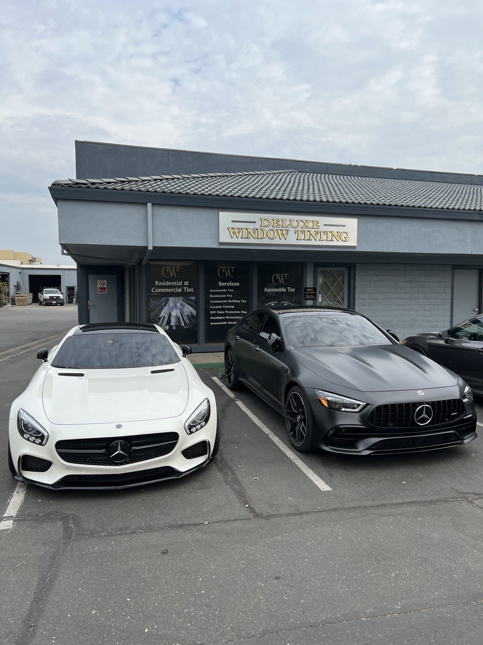Two Mercedes-Benz cars with professional window tinting at Deluxe Window Tinting in Gold River, CA.