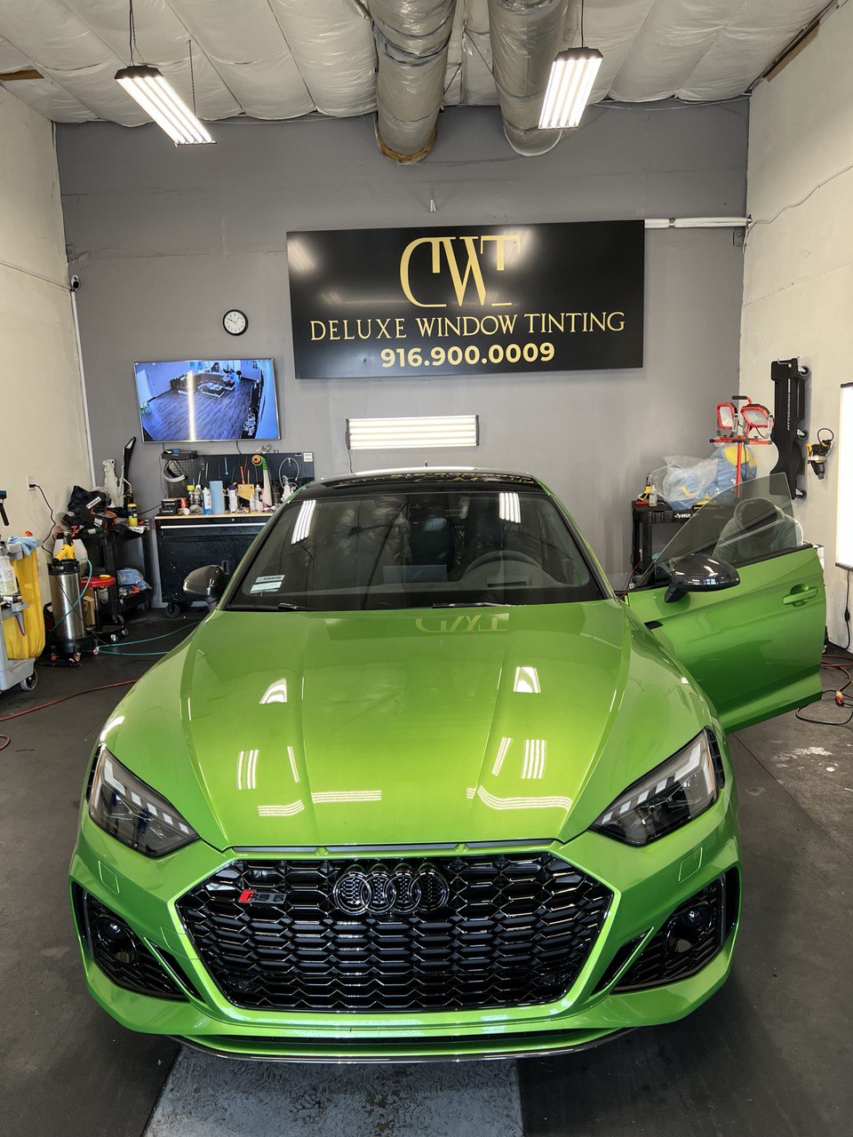 Green Audi RS5 in a professional window tinting shop in Gold River, CA.